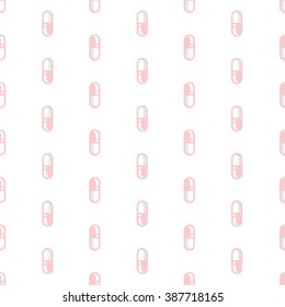 Pink pills on white background