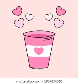 pink plastic cup with a white heart and small stickers in the form of a heart side by side isolated on a beige background Valentine's day concept of the holiday of love and happiness