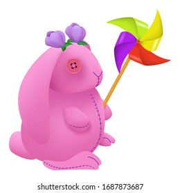 pink plush rabbit toy with windmill isolated on white