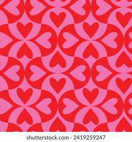 Corazón rosa y rojo sobre formas geométricas de vieira sin costura. Para papel pintado, decoración casera y tarjeta de felicitación del día de San Valentín. 