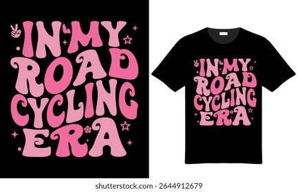 Pink retro typography on black tshirt design features the words In My Road Cycling Era with additional small design elements. The font is groovy and stylized.