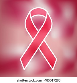 Pink ribbon on blurred background