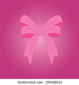 pink ribbon over pink background