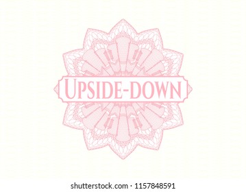 Pink rosette or money style emblem with text Upside-down inside