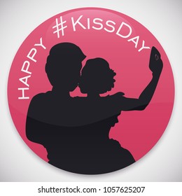 Pink round button with couple silhouette kissing and taking a selfie to share their love in Kiss Day celebration.