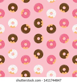 Pink seamless pattern with glazed donuts