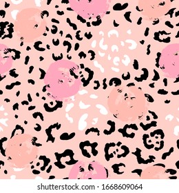 Pink seamless pattern with leopard's spots and hand drawn style rounds. Vector illustration.