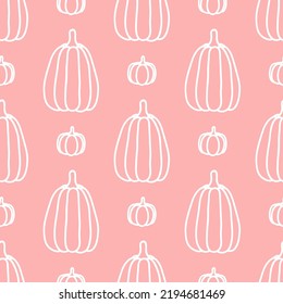 Pink seamless pattern with white hand drawn pumpkins.