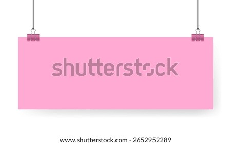 Pink sheet of paper note hanging on binder clip. Long wide banner with panoramic orientation.