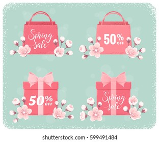 Pink shopping paper bags and  gift boxes set. Cherry blossom, spring flowers. Spring sale lettering. Retro vector design elements