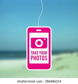 Pink Smartphone Symbol with Camera Icon and a Text: "Take Your Photos", Blurred Photo Background (Beach View)