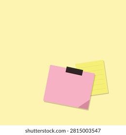 A pink sticky note clipped to a yellow lined notepad, ready for writing and organizing notes.