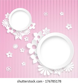 Pink striped background with two rings and flowers cut out of paper