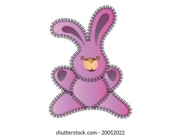 Pink toy rabbit is sitting
