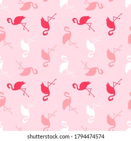 Pink vector seamless pattern background with flamingo silhouettes.
