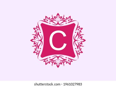 Pink vintage frame with C initial letter in the middle