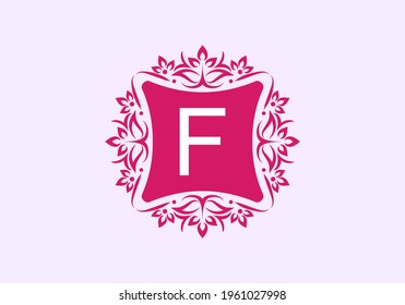 Pink vintage frame with F initial letter in the middle
