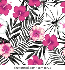 Pink white hibiscus flowers on a black and white background of leaves. Seamless vector beach wallpaper pattern