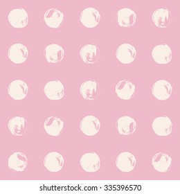 Pink and white polka dot seamless pattern, grunge texture, hand painted brush strokes and dabs.