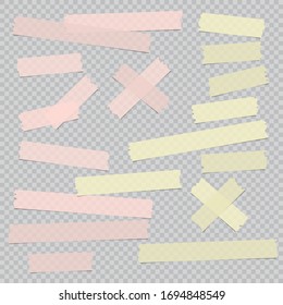 Pink and yellow different size adhesive, sticky, masking, tape, paper pieces are on grey squared background