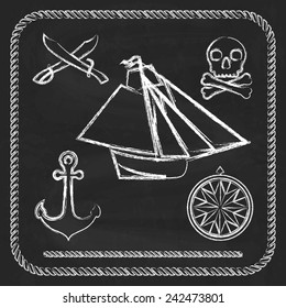 Pirate icons - sloop, cutlass and Jolly Roger on chalkboard  background