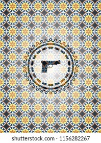 pistol icon inside arabic badge background. Arabesque decoration.
