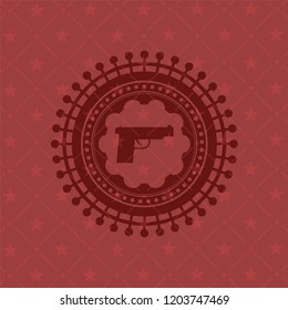 pistol icon inside badge with red background