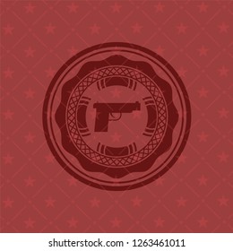 pistol icon inside badge with red background