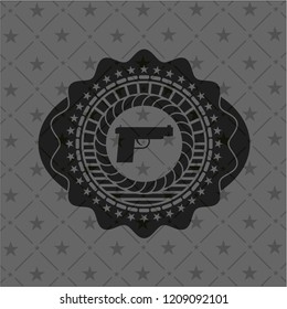 pistol icon inside black emblem
