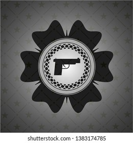 pistol icon inside black emblem