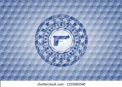 pistol icon inside blue emblem with geometric background.