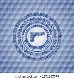 pistol icon inside blue polygonal badge.
