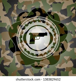 pistol icon inside camo emblem