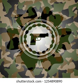 pistol icon inside camouflage texture