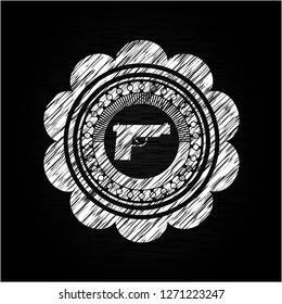 pistol icon inside chalk emblem