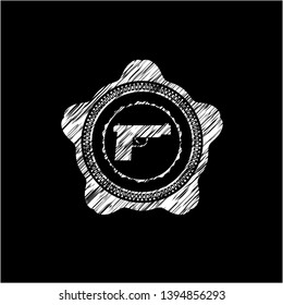 pistol icon inside chalkboard emblem