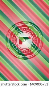 pistol icon inside christmas emblem background.