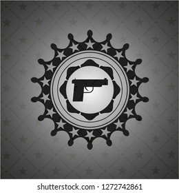 pistol icon inside dark badge