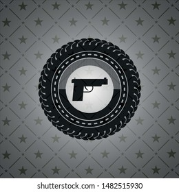 pistol icon inside dark badge