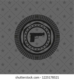 pistol icon inside dark emblem