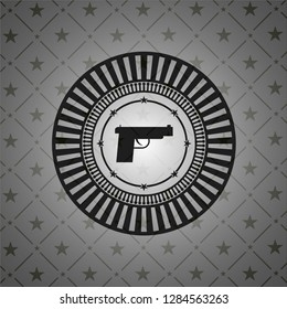 pistol icon inside dark emblem. Retro