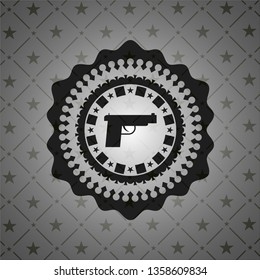 pistol icon inside dark emblem