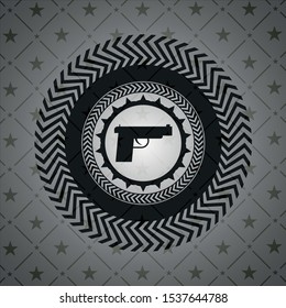 pistol icon inside dark emblem. Retro