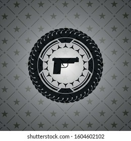 pistol icon inside dark emblem. Retro