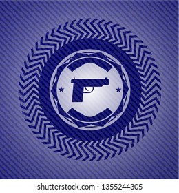 pistol icon inside emblem with jean texture