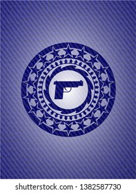 pistol icon inside emblem with jean texture