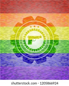 pistol icon inside emblem on mosaic background with the colors of the LGBT flag