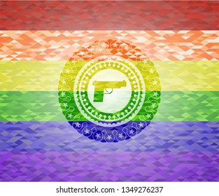 pistol icon inside emblem on mosaic background with the colors of the LGBT flag