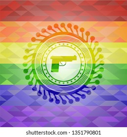 pistol icon inside emblem on mosaic background with the colors of the LGBT flag