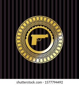 pistol icon inside gold emblem or badge